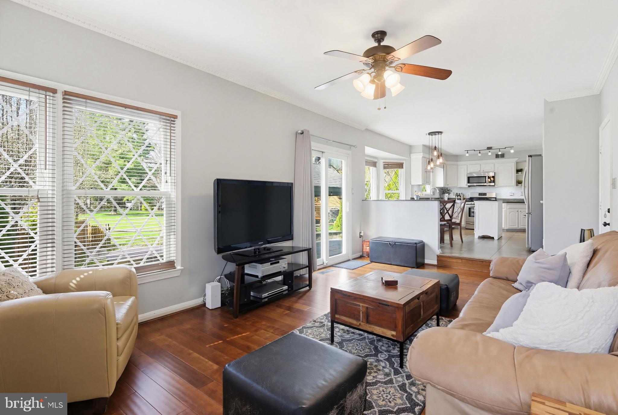 18906 Lindenhouse Road Gaithersburg, MD 20879 - Photo 12 of 48 a living room with furniture and a flat screen tv