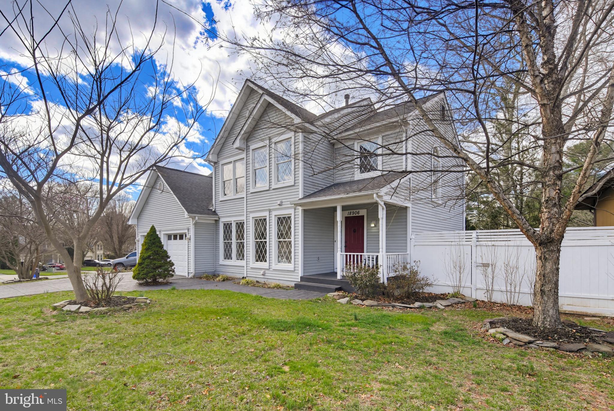 18906 Lindenhouse Road Gaithersburg, MD 20879 - Photo 2 of 48 a front view of a house with garden