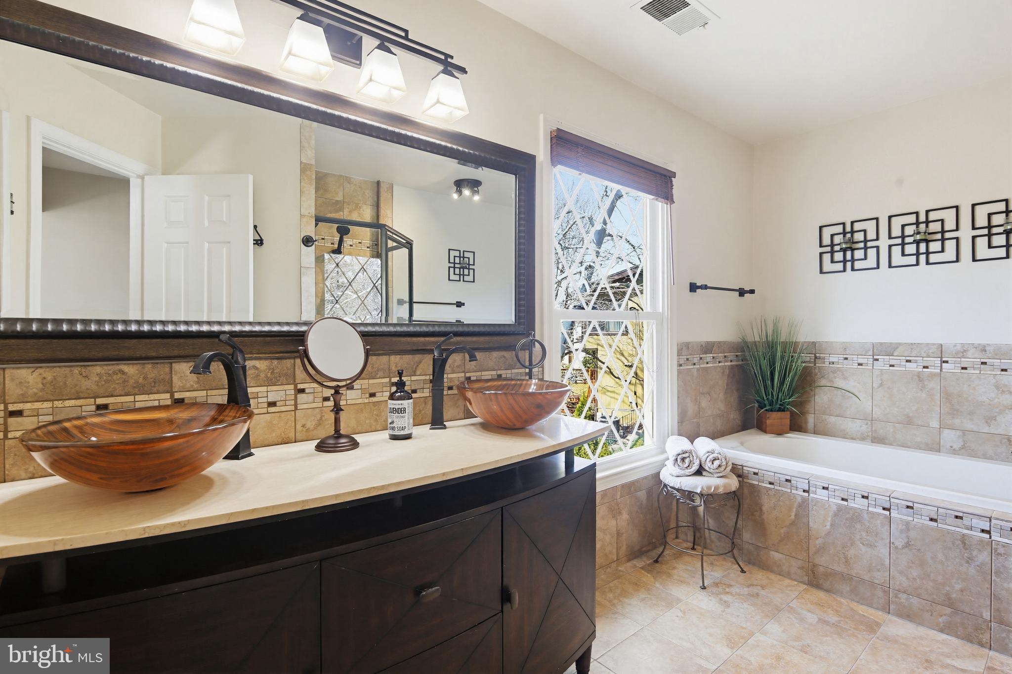 18906 Lindenhouse Road Gaithersburg, MD 20879 - Photo 24 of 48 a bathroom with a sink and a mirror