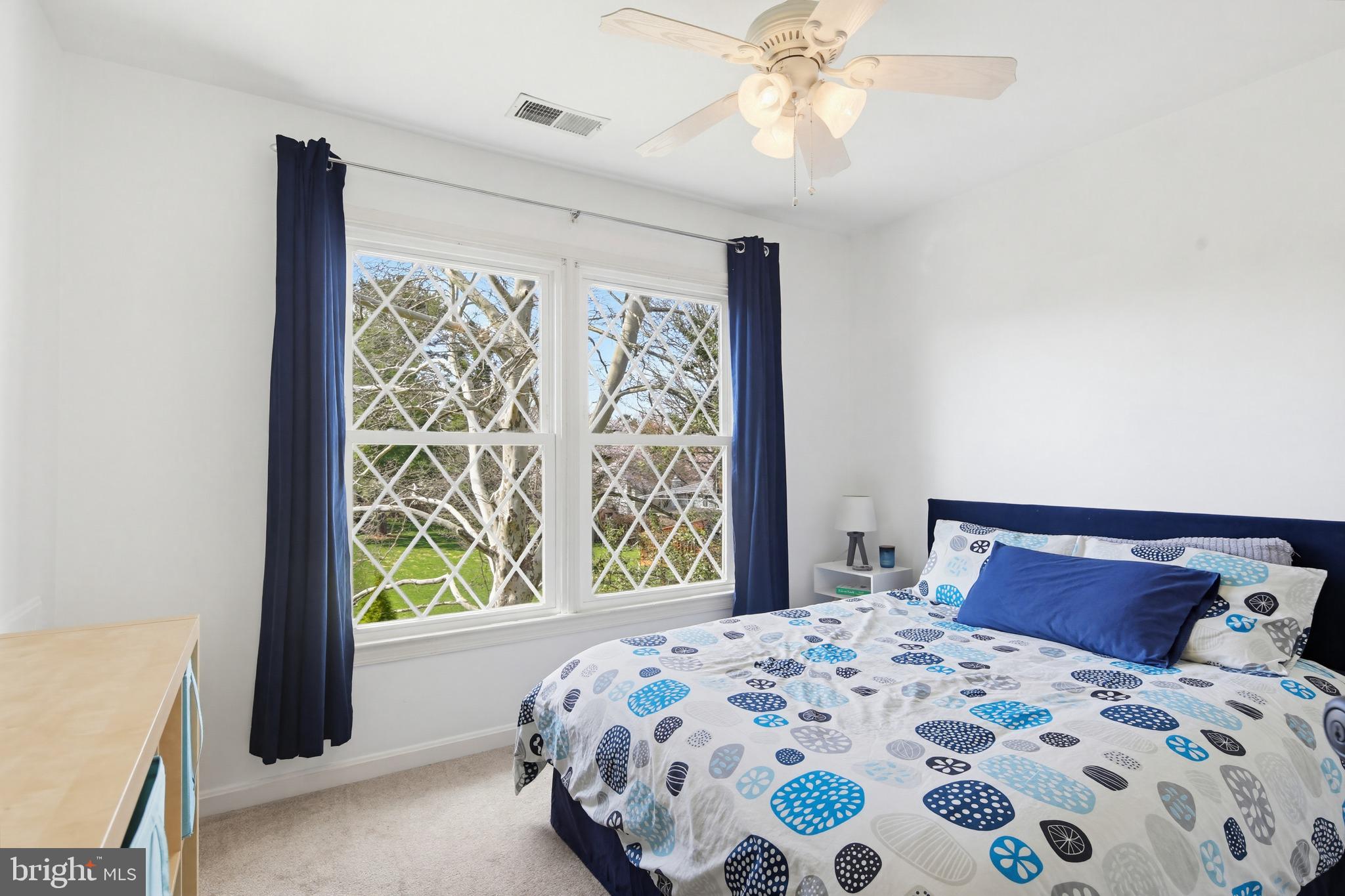 18906 Lindenhouse Road Gaithersburg, MD 20879 - Photo 26 of 48 a bedroom with a bed and a window