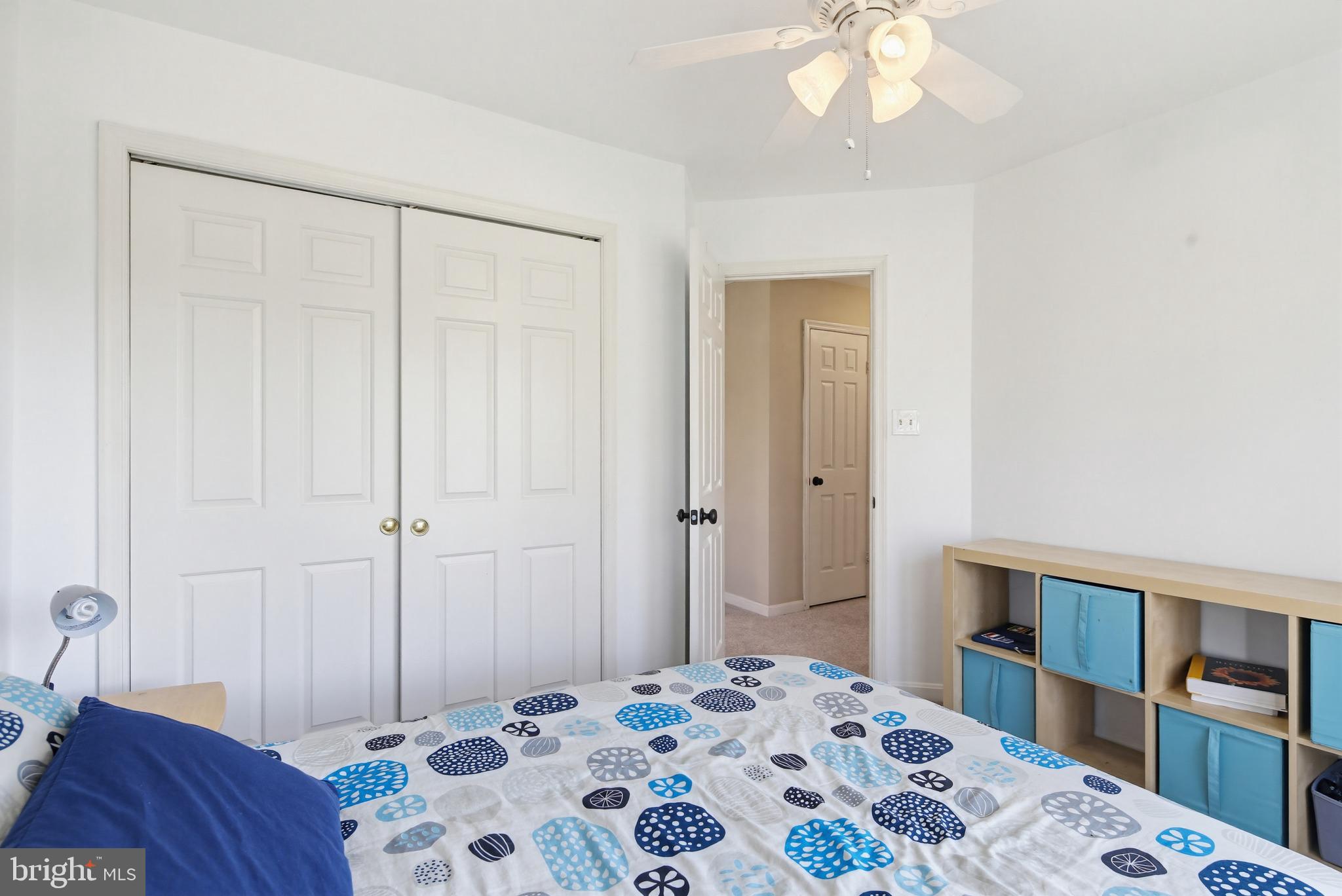 18906 Lindenhouse Road Gaithersburg, MD 20879 - Photo 27 of 48 a bedroom with a bed and a chandelier