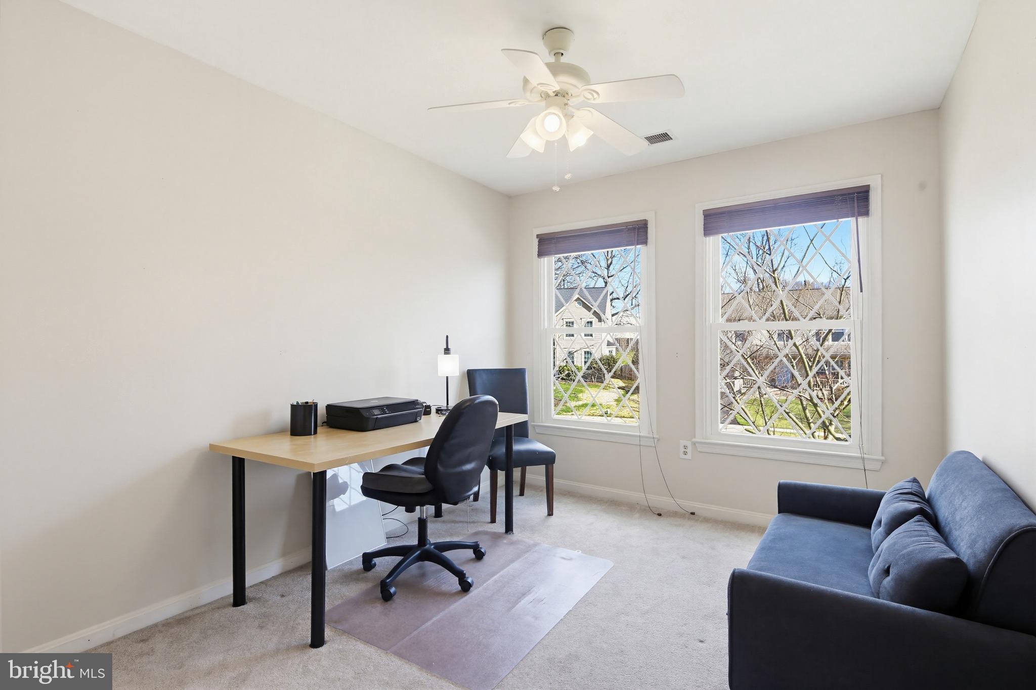 18906 Lindenhouse Road Gaithersburg, MD 20879 - Photo 30 of 48 a view of a livingroom with workspace and a window
