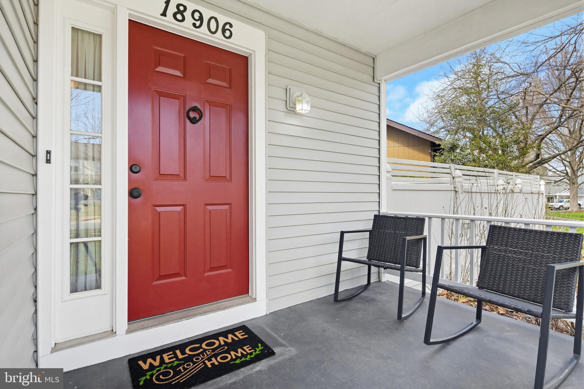 18906 Lindenhouse Road Gaithersburg, MD 20879 - Photo 3 of 48 a view of a door with a chair and table