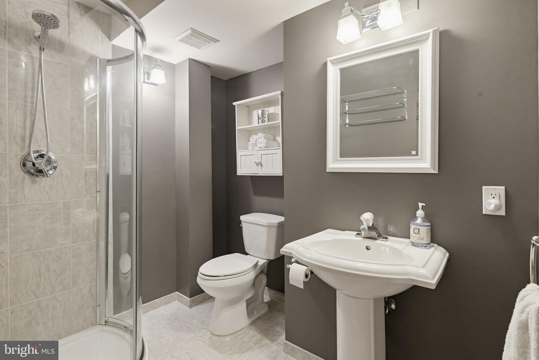 18906 Lindenhouse Road Gaithersburg, MD 20879 - Photo 39 of 48 a bathroom with a toilet sink and mirror