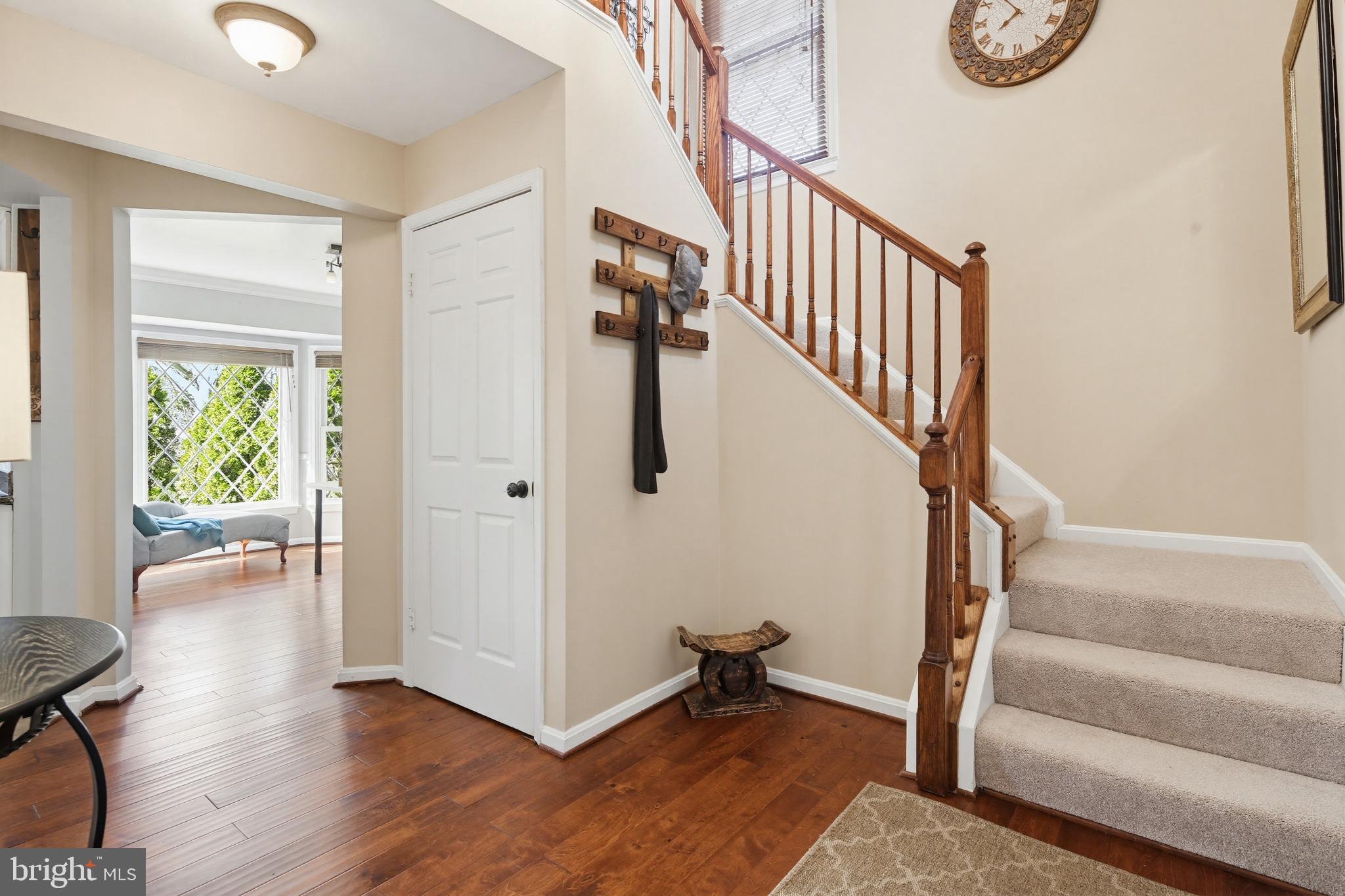 18906 Lindenhouse Road Gaithersburg, MD 20879 - Photo 4 of 48 a view of entryway with wooden floor and stairs