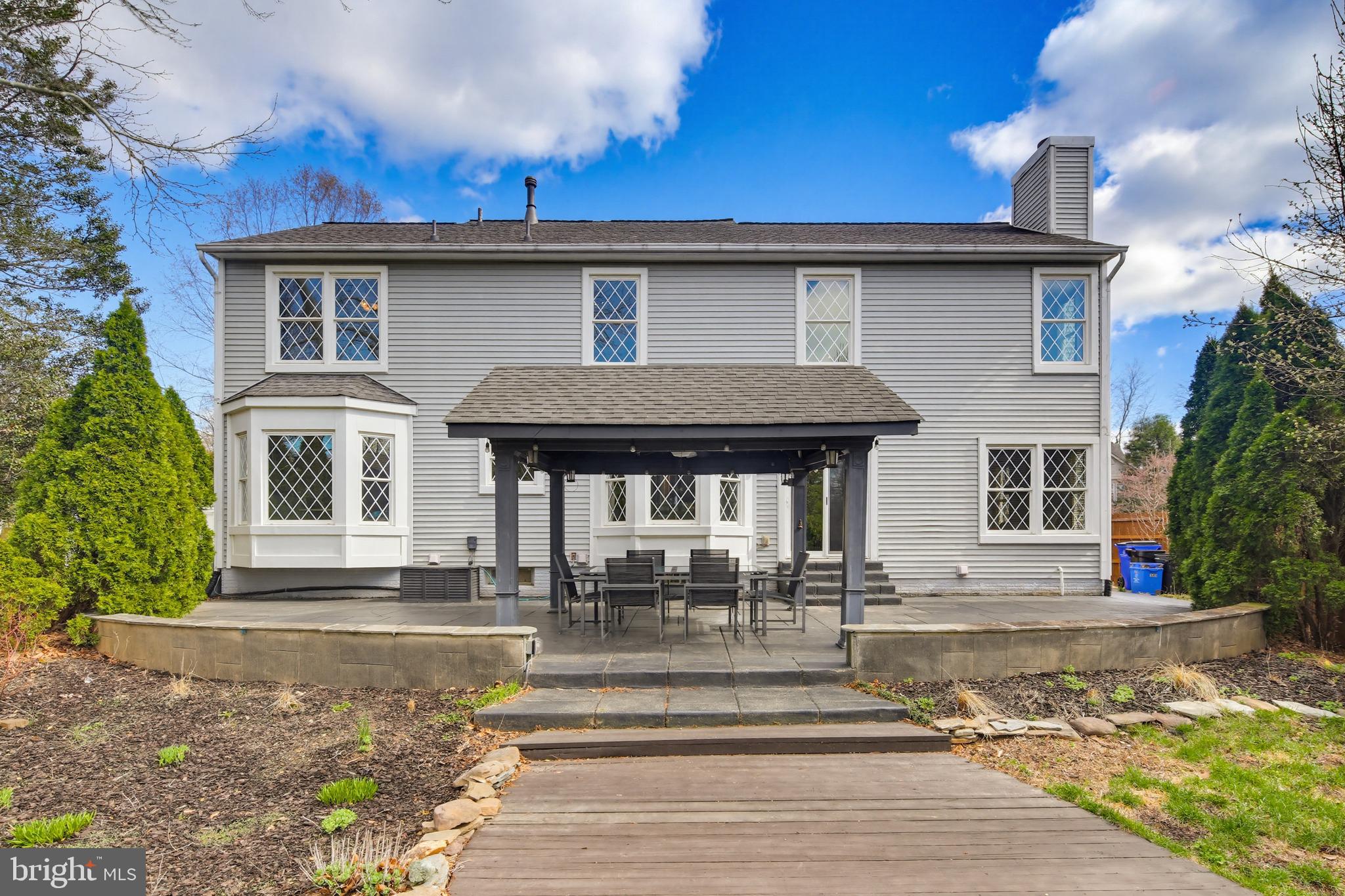 18906 Lindenhouse Road Gaithersburg, MD 20879 - Photo 43 of 48 a view of a house with a patio