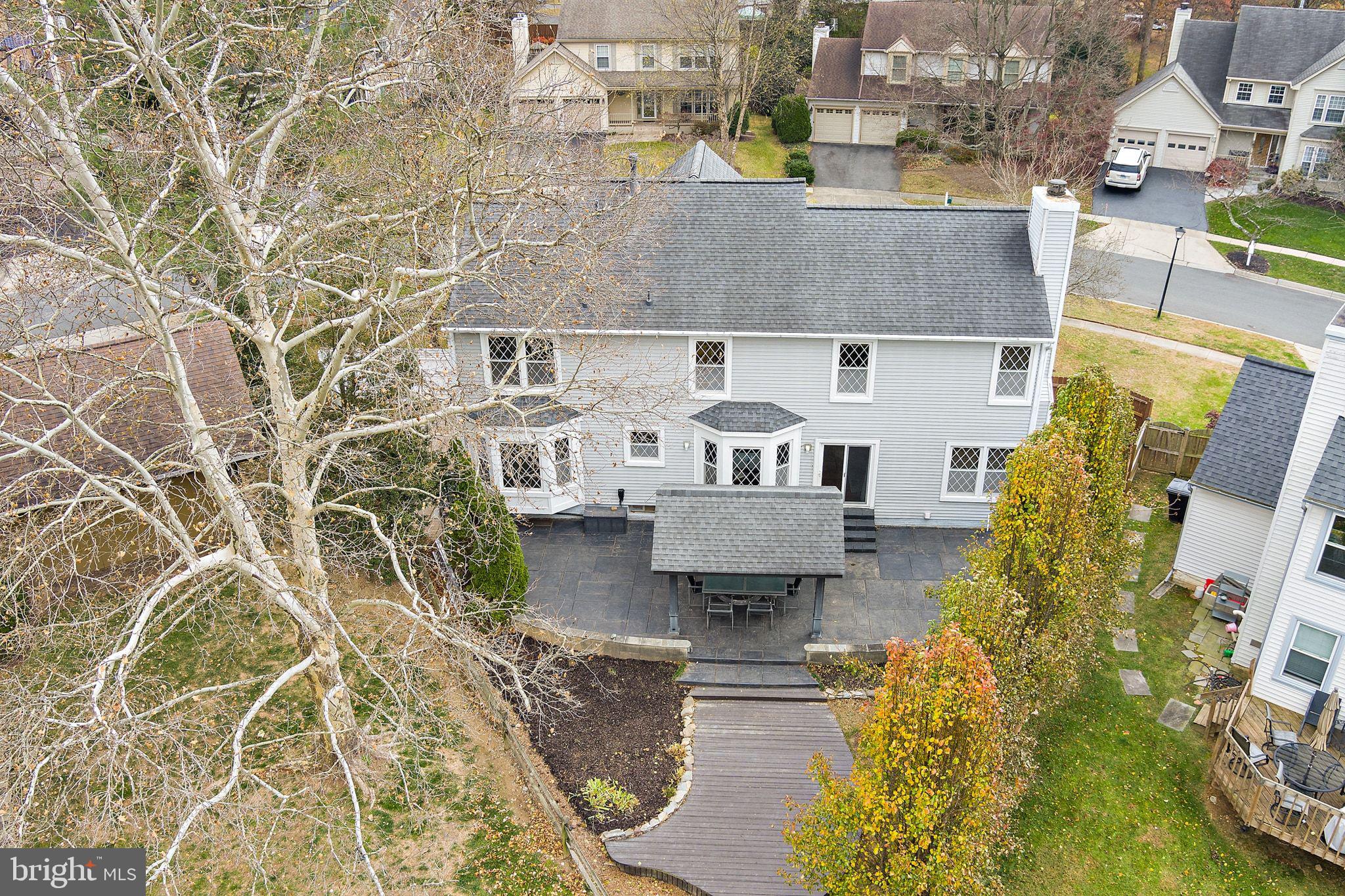 18906 Lindenhouse Road Gaithersburg, MD 20879 - Photo 45 of 48 an aerial view of a house with a yard and sitting area