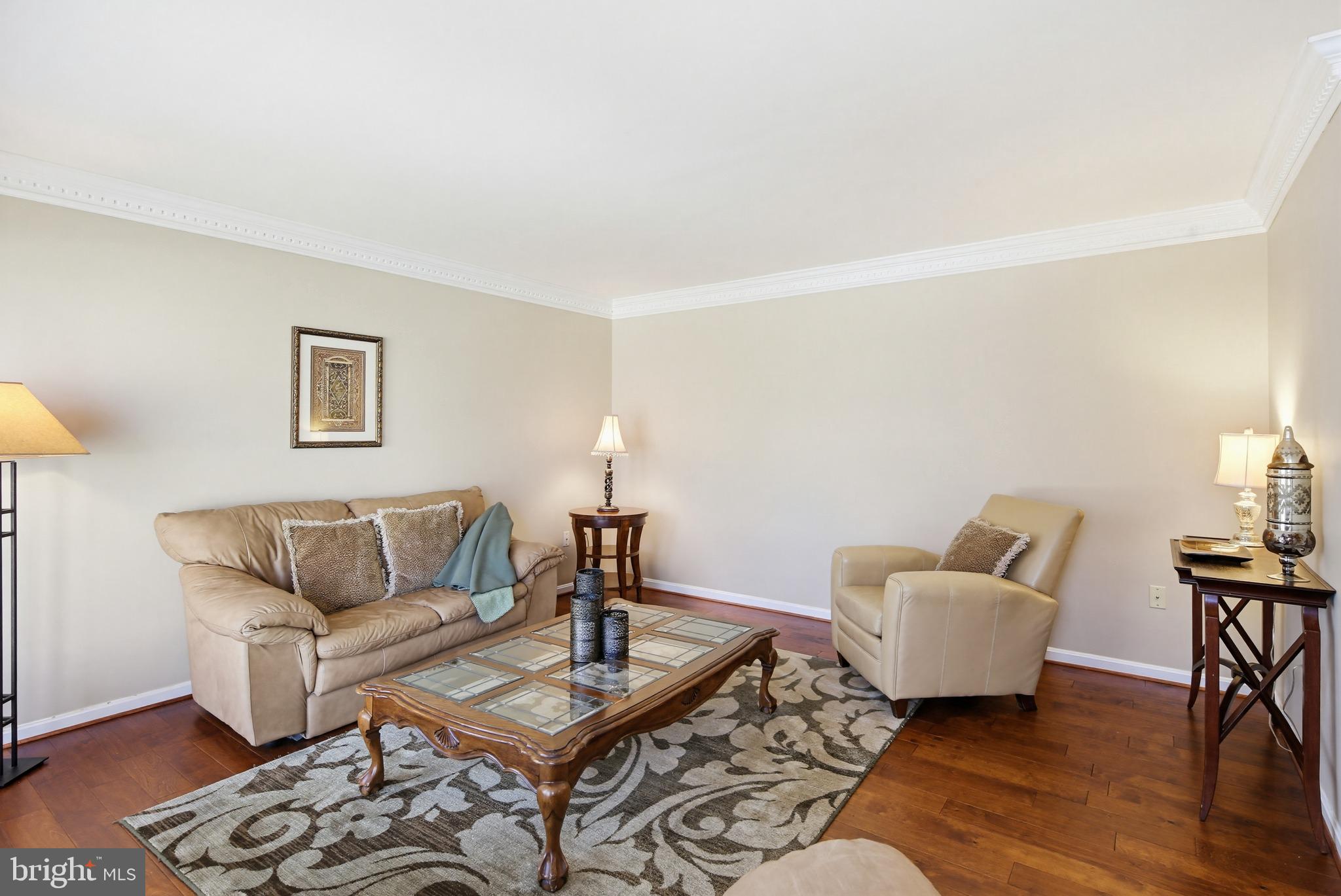 18906 Lindenhouse Road Gaithersburg, MD 20879 - Photo 5 of 48 a living room with furniture and wooden floor