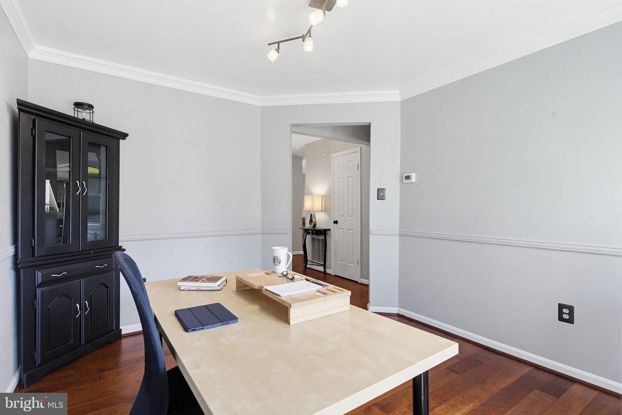 18906 Lindenhouse Road Gaithersburg, MD 20879 - Photo 8 of 48 a view of a dining room with furniture