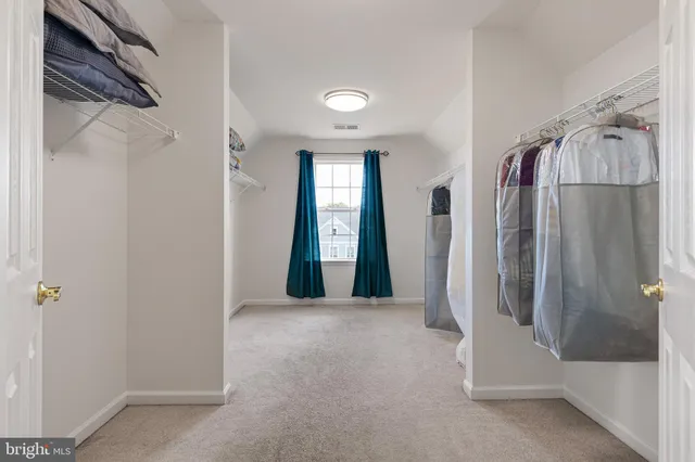 a view of a bathroom with a glass door shower