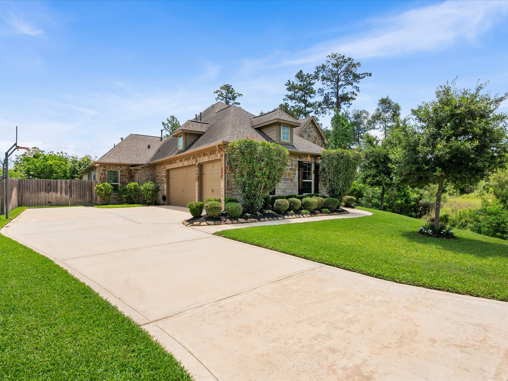 12618 Ranger Court Magnolia, TX 77354 - Photo 3 of 45 Extended Driveway leading to a 3 car garage