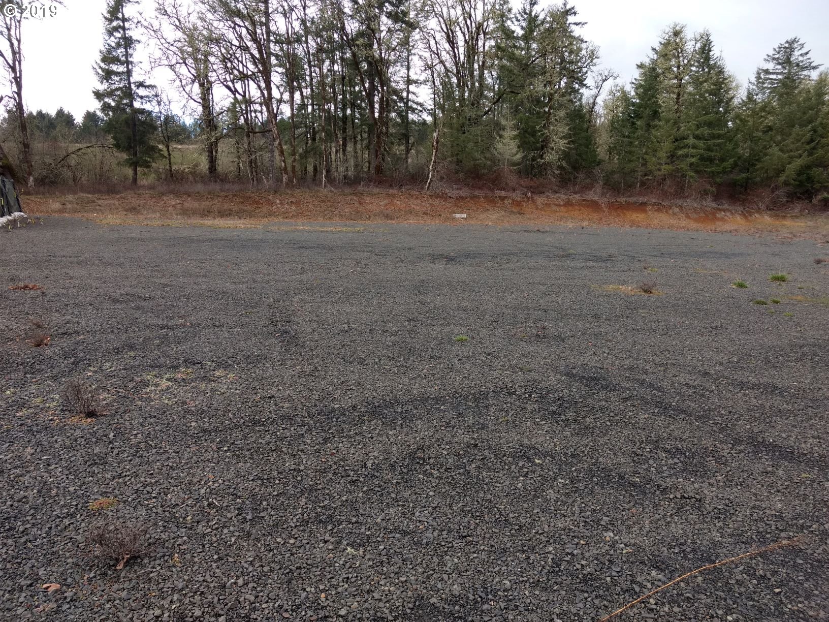 2509 Liberty Road Dallas, OR 97338 - Photo 9 of 9 a view of dirt field with trees