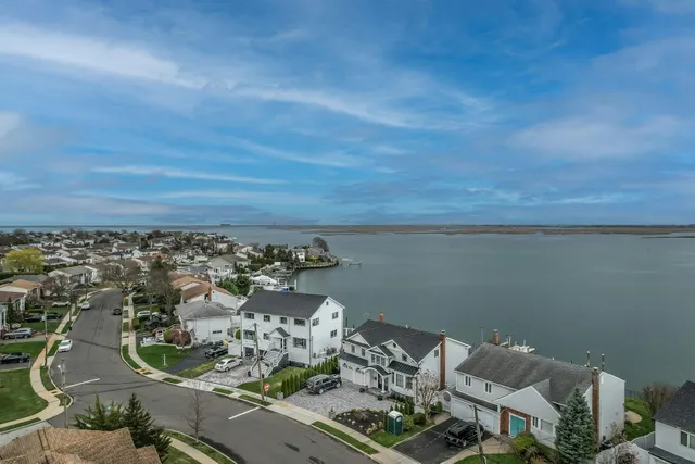 an aerial view of a house with lots of residential buildings