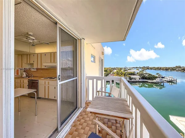 a view of city street with ocean view