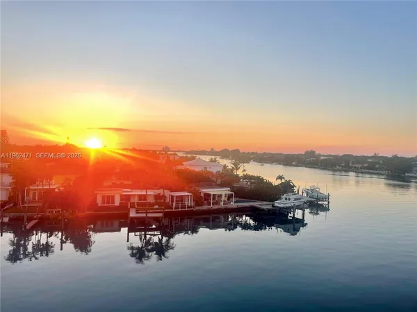 a view of a swimming pool with a table and chairs