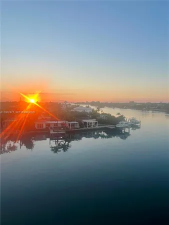 a view of a lake with tall buildings