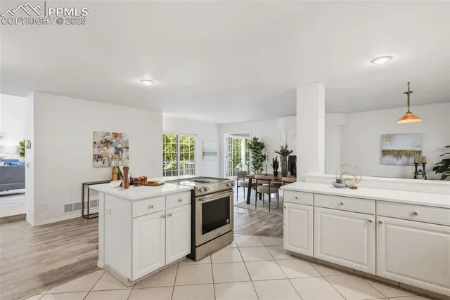 a kitchen with a sink stove and cabinets