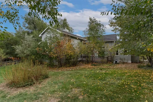 a backyard of a house with lots of green space