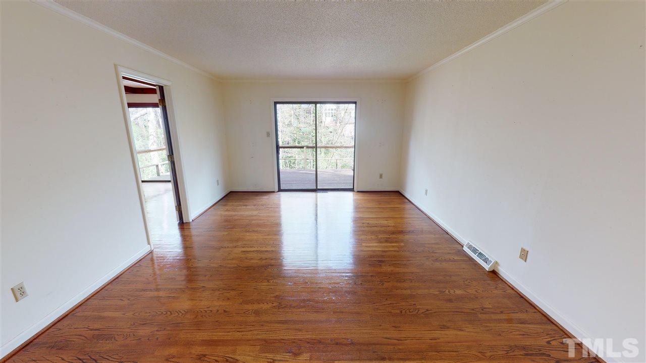 1114 Manchester Drive Raleigh, NC 27609 - Photo 12 of 30 wooden floor in an empty room with a window