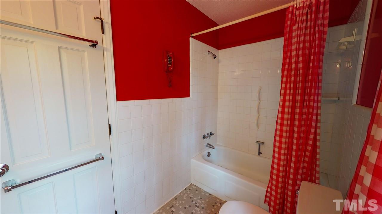 1114 Manchester Drive Raleigh, NC 27609 - Photo 25 of 30 a bathroom with a bathtub and shower