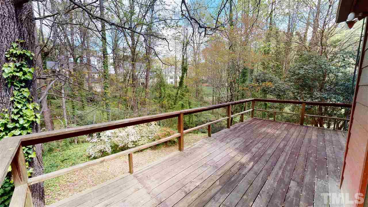 1114 Manchester Drive Raleigh, NC 27609 - Photo 5 of 30 a view of balcony with wooden floor and fence