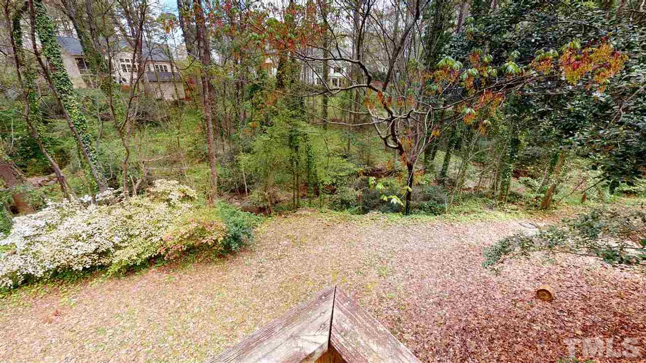 1114 Manchester Drive Raleigh, NC 27609 - Photo 8 of 30 a view of a yard with plants and trees