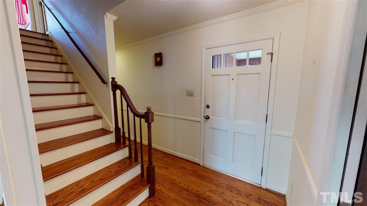 1114 Manchester Drive Raleigh, NC 27609 - Photo 9 of 30 a view of entryway with wooden floor