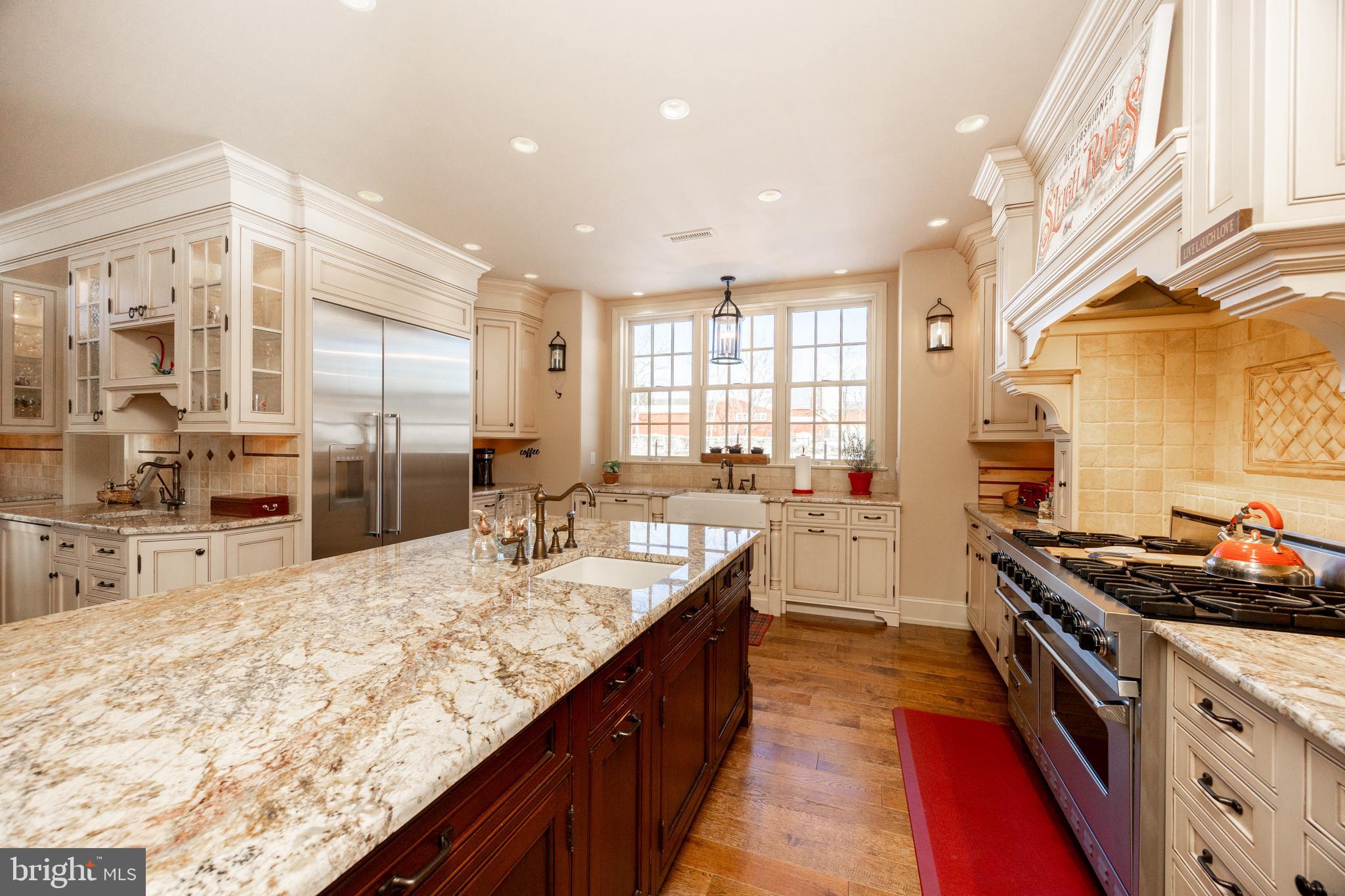 2230 Creek Road Glenmoore, PA 19343 - Photo 23 of 86 a kitchen with stainless steel appliances granite countertop a sink stove and refrigerator