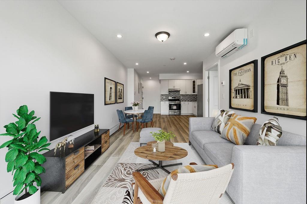 1307 84th Street, Unit 3B Brooklyn, NY 11228 - Photo 13 of 17 a living room with furniture and a flat screen tv
