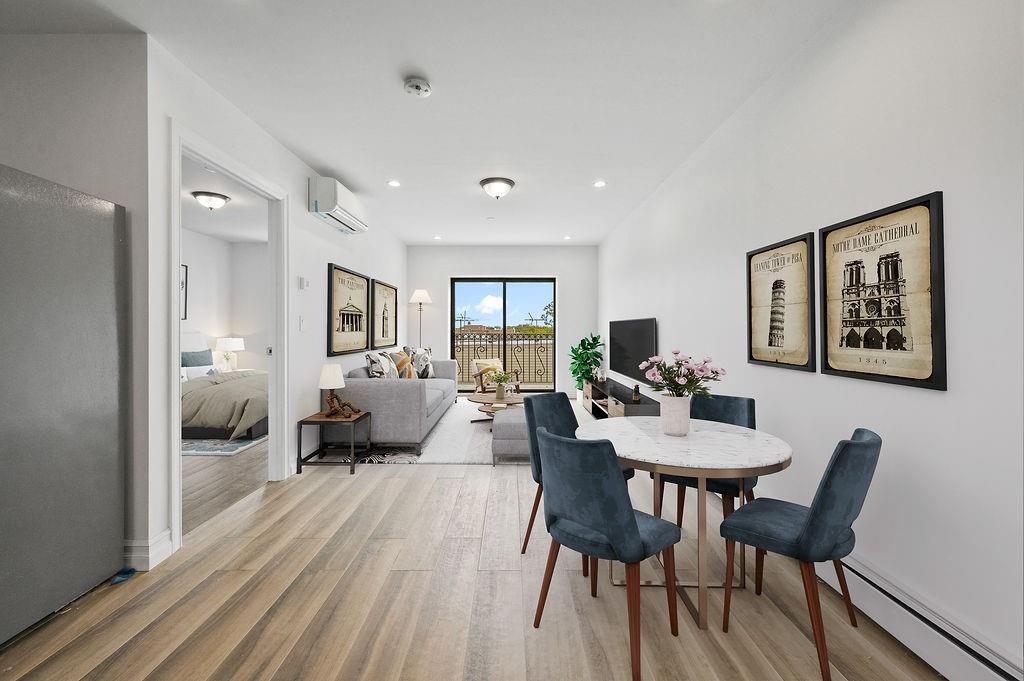 1307 84th Street, Unit 3B Brooklyn, NY 11228 - Photo 15 of 17 a living room with furniture and a wooden floor