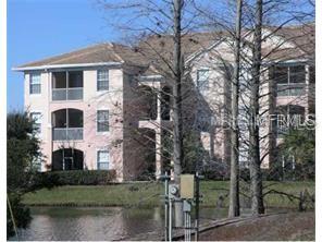 13536 Turtle Marsh Loop, Unit 522 Orlando, FL 32837 - Photo 1 of 1 a front view of a house with a yard