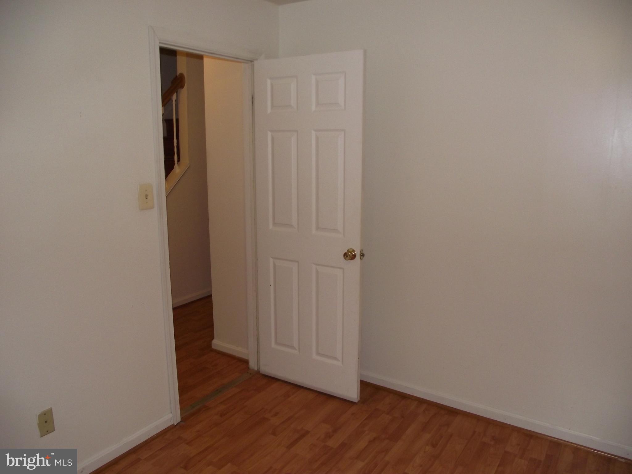 8502 Kernon Court, Unit BASEMENT APARTMENT Lorton, VA 22079 - Photo 2 of 10 a view of an empty room with wooden floor