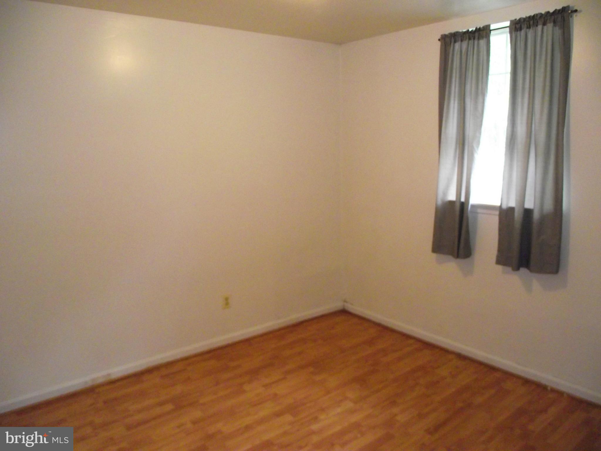 8502 Kernon Court, Unit BASEMENT APARTMENT Lorton, VA 22079 - Photo 10 of 10 a view of an empty room and window