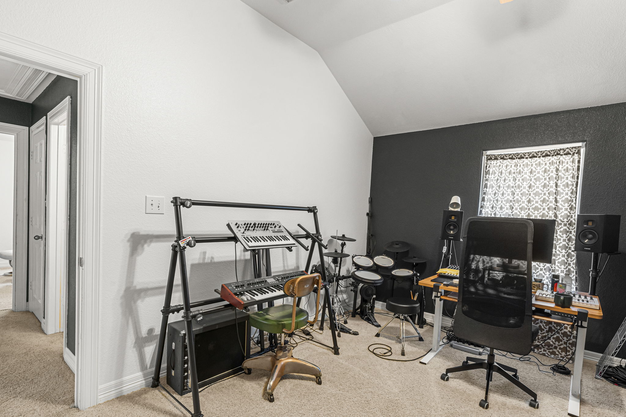 454 Fall Circle Kyle, TX 78640 - Photo 25 of 39 An adaptable space with vaulted ceilings, ideal for a home office or creative studio.