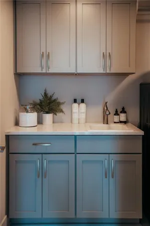 a large bed sitting in a bedroom next to a window