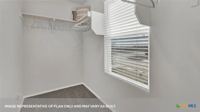 a view of a small space with racks on the wall