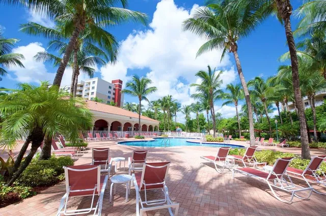 a view of a swimming pool with chairs