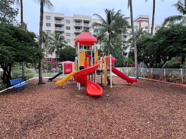 a view of a park with a slide