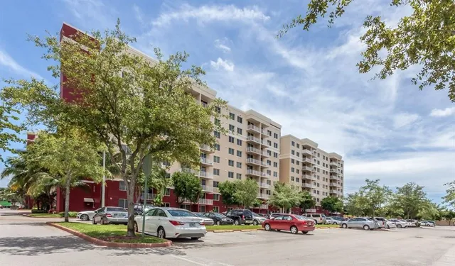 a city street lined with buildings and cars