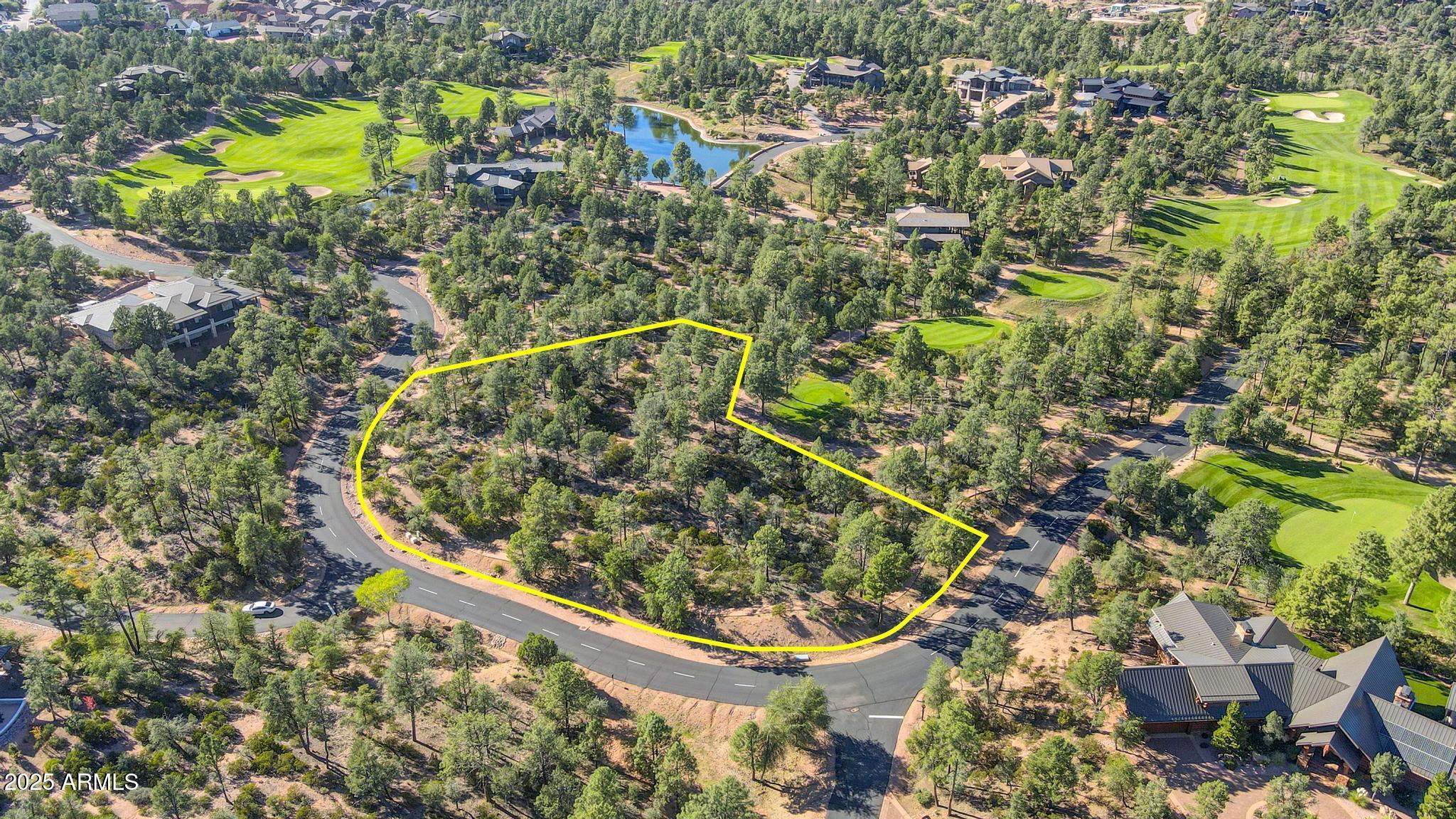 404 South Rim Club Drive, Unit 35 Payson, AZ 85541 - Photo 2 of 10 a view of a back yard of the house and swimming pool