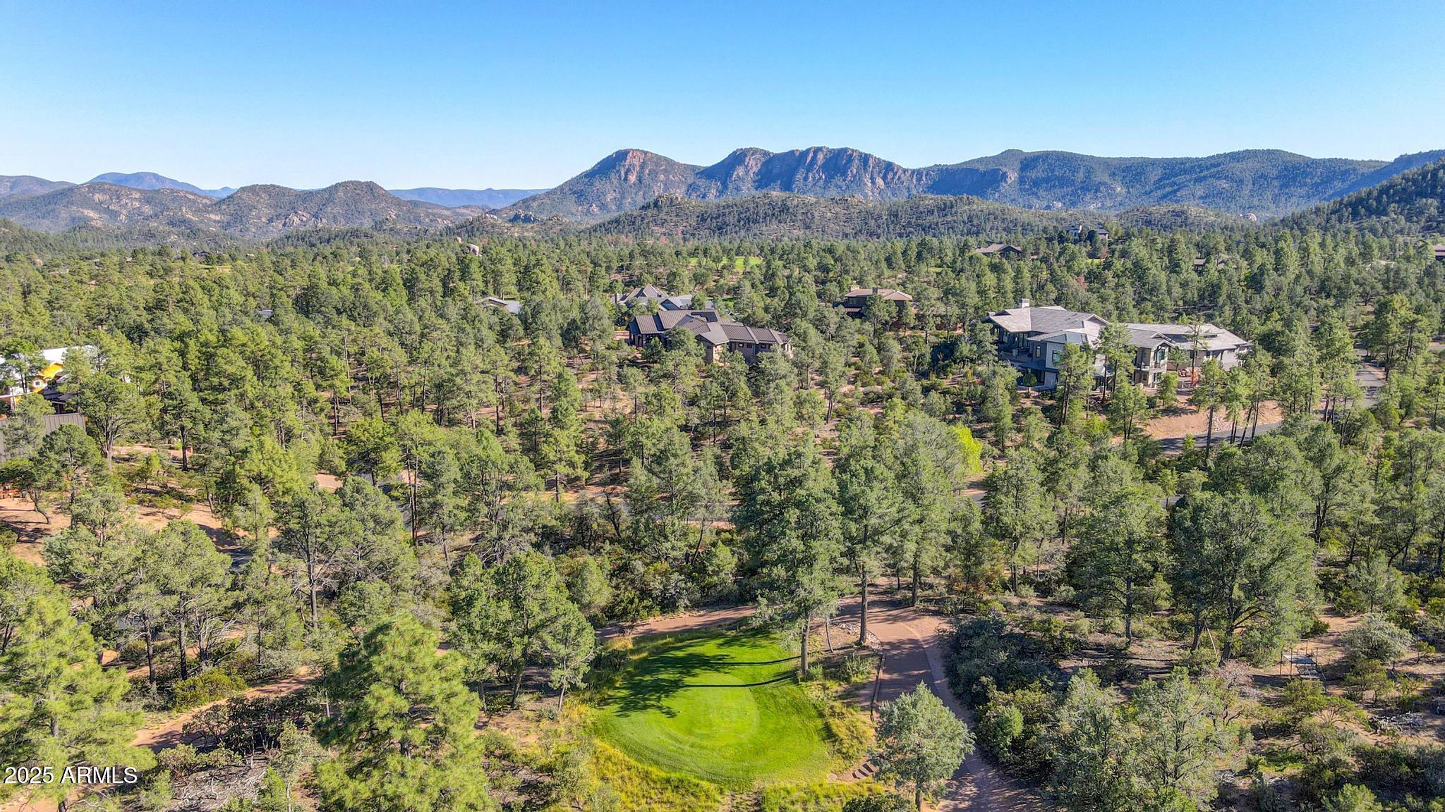 404 South Rim Club Drive, Unit 35 Payson, AZ 85541 - Photo 6 of 10 a view of a lush green hillside and a houses