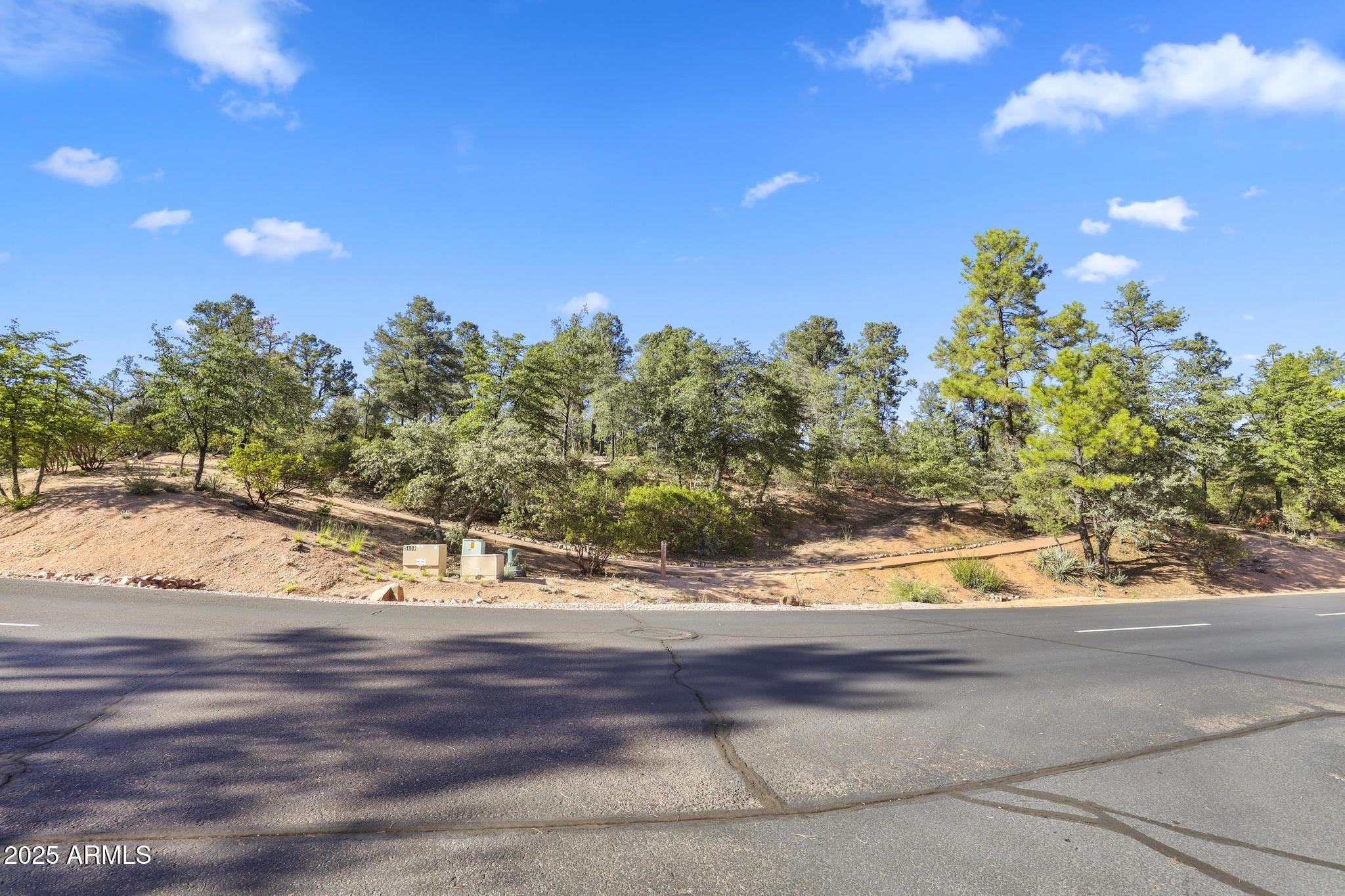 404 South Rim Club Drive, Unit 35 Payson, AZ 85541 - Photo 10 of 10 a view of a yard with wooden fence