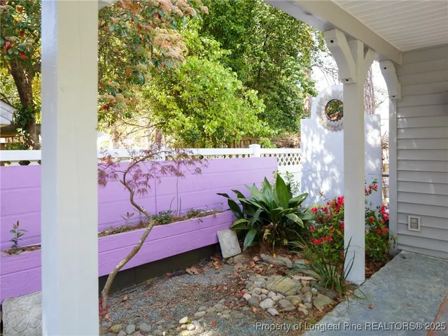 a view of a house with a flower garden