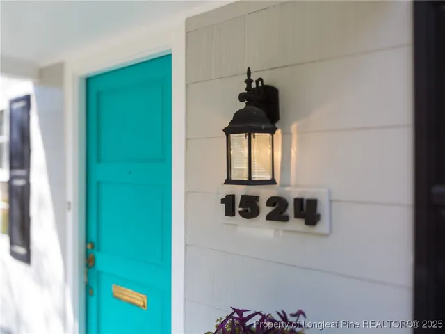 a view of a closet area with wooden floor