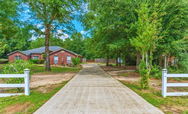 a front view of a house with yard
