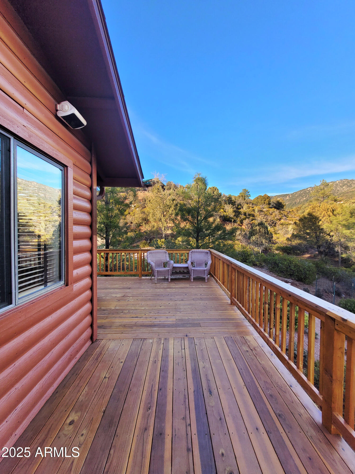 5579 Solitude Trail Loop Pine, AZ 85544 - Photo 9 of 50 a view of balcony with wooden floor and city view