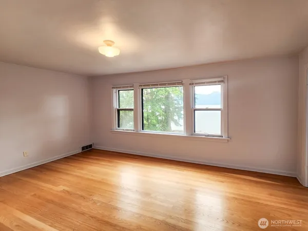 a view of a hallway with washer and dryer