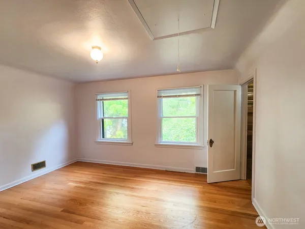 a view of a house with a yard covered in snow