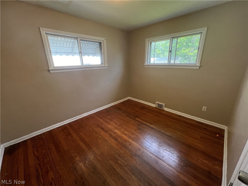 20731 Donnybrook Road Maple Heights, OH 44137 - Photo 7 of 17 Unfurnished room featuring dark hardwood / wood-style floors