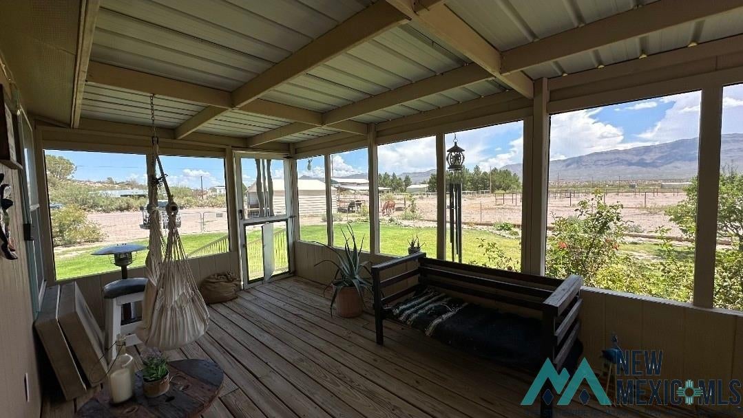 4 Midway Road Caballo, NM 87931 - Photo 27 of 43 Sunroom featuring a deck with mountain view and beamed ceiling